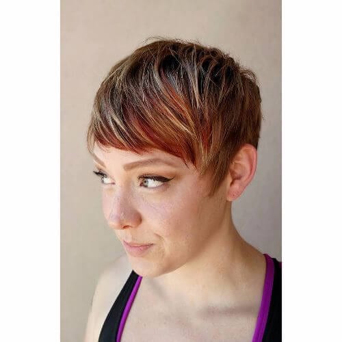 pixie hairstyle with red, blonde and caramel highlights
