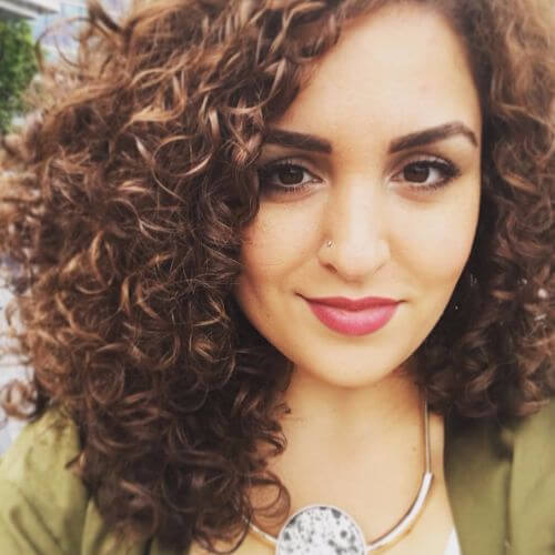 curly hair with caramel highlights 