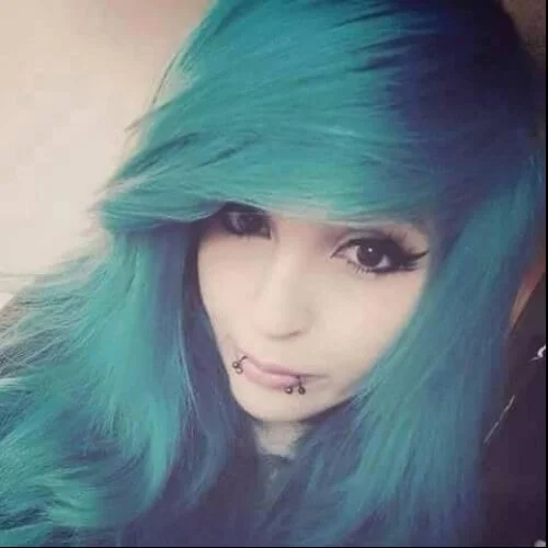Long emo hairstyles for girls with blue highlights and side-swept bangs