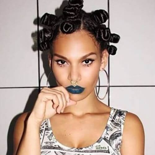Woman with bantu knots looking towards the camera