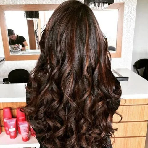 Chocolate brown wavy hairstyle with rich color and defined waves