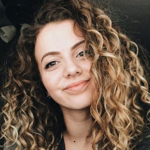 curly brown hair with blonde highlights