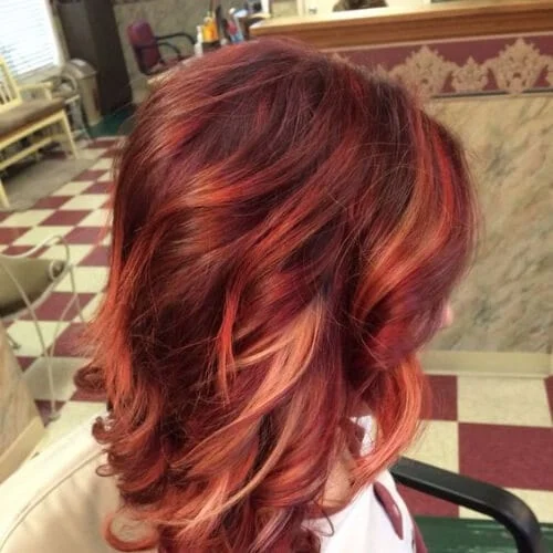 Red Hair Color with Blonde, copper and rose gold high highlights and lowlights