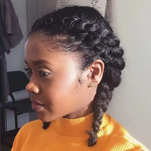 Cute pigtails of a natural kinky hair
