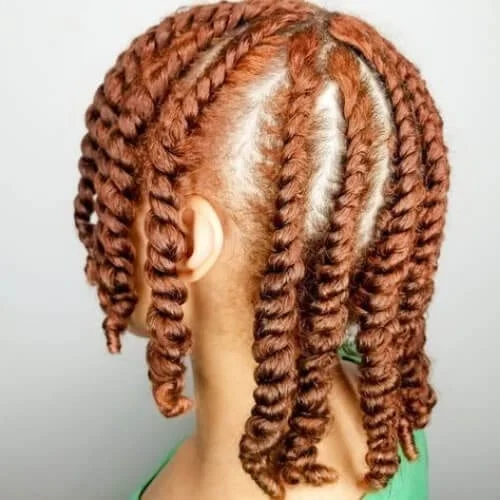 ginger hair of a woman in green top
