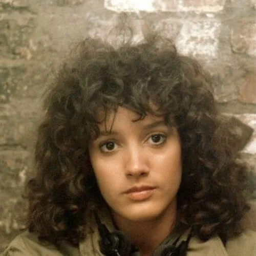 Jennifer Beals flashdance curly hair with bangs