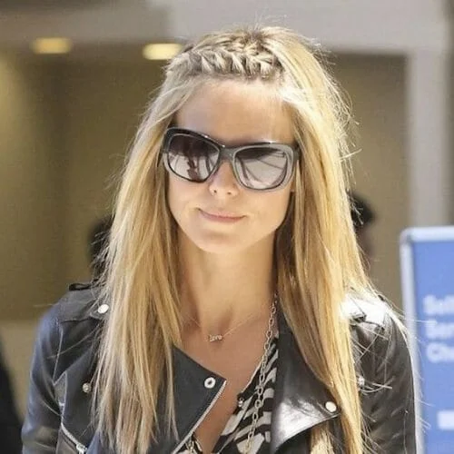 Heidi Klum sporting elegant braided bangs with side-swept styling technique