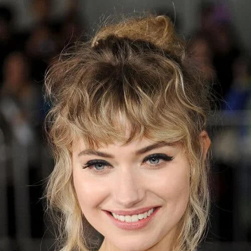 Imogen Poots celebrity curly hairstyle featuring blonde waves in elegant updo with wispy textured bangs