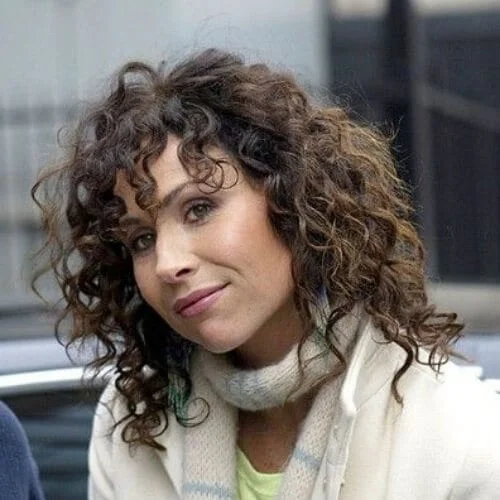minnie driver curly hair with bangs