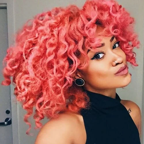 peach curly hair with bangs
