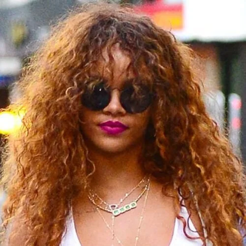 rihanna curly hair with bangs