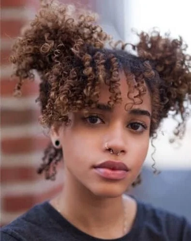 space buns curly hair with bangs