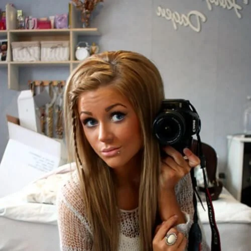 Young woman showing off trendy braided bangs perfect for selfies and everyday styling