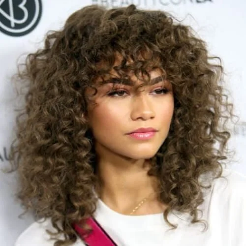 zendaya curly hair with bangs