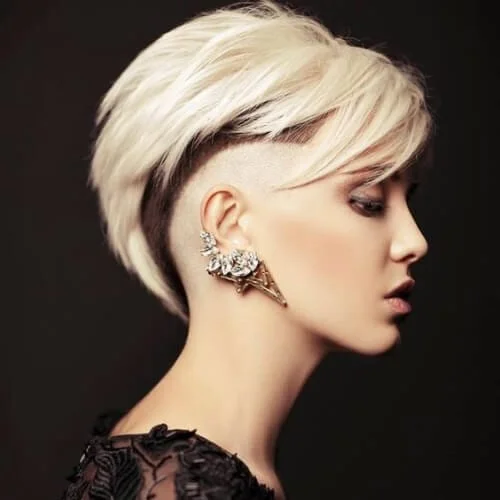 Current short punk hairstyles with fauxhawk and blonde highlights - modern edgy haircut
