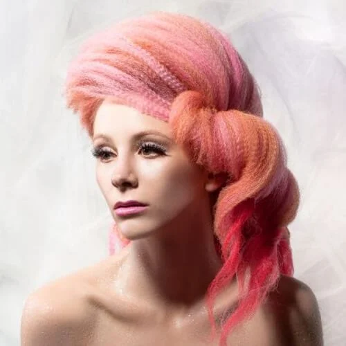 Pink crimped hairstyles with vibrant color and textured waves - bold hair transformation