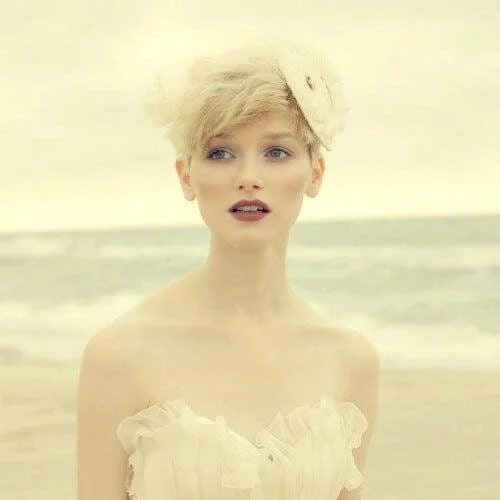 Beach wedding hairstyles for short hair with fascinator and natural styling - seaside bridal looks