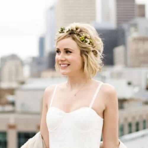 Sweet wedding hairstyles for short hair with flower crown and romantic styling - bridal pixie cut inspiration