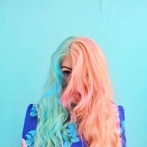 Pastel pink and turquoise two tone hair color with soft hipster aesthetic - dreamy split dye style