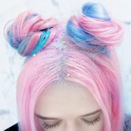 Space buns with two tone hair color in creative festival styling - fun split dye hairstyle