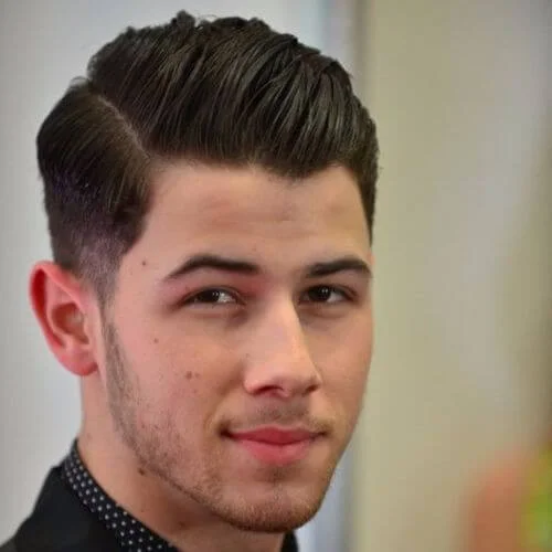 Long swept back top hairstyle for men with thin hair creating volume and movement