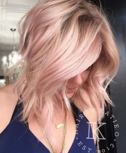 rose gold strawberry blonde in choppy layers