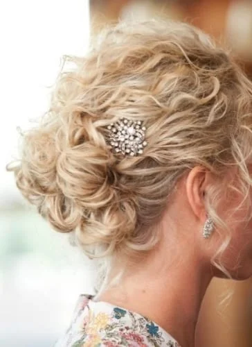 short curly hair updo with hair accessories