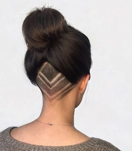 High Bun with Undercut and Shaved Designs