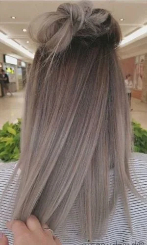 Cool ash blonde hair color perfect for fall with subtle dimension