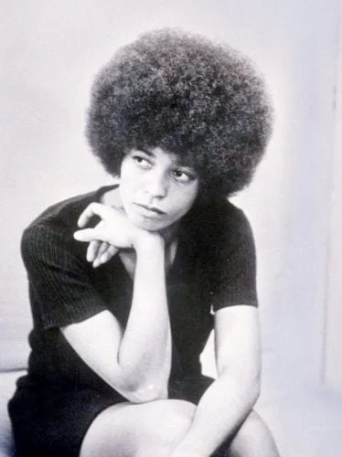 Angela Davis afro hairstyle - iconic natural hair symbol of Black Power movement