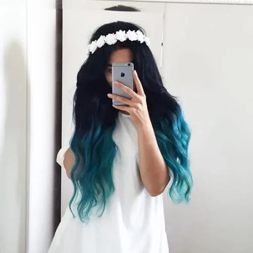 Black hair with blue tips in soft ombre effect with boho styling