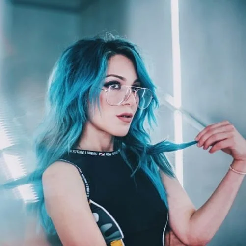 Blue ombre hair with smooth transition from dark roots to turquoise blue tips