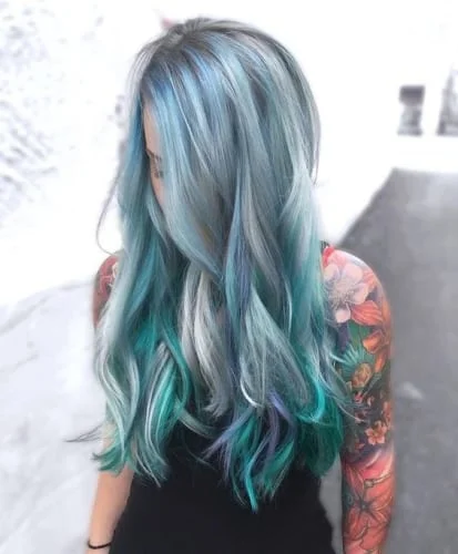 Green silver blue hair with cool tones and metallic finish creating a futuristic look