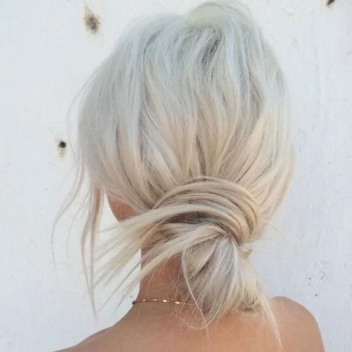 sleek messy platinum blonde bun