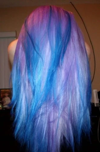 Multi-colored hair combining pink base with blue, purple, and white highlights