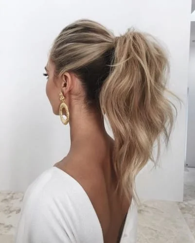 Messy high ponytail hairstyle with textured volume - perfect for casual everyday wear
