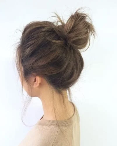 High and Messy and Voluminous Bun for Thick Hair