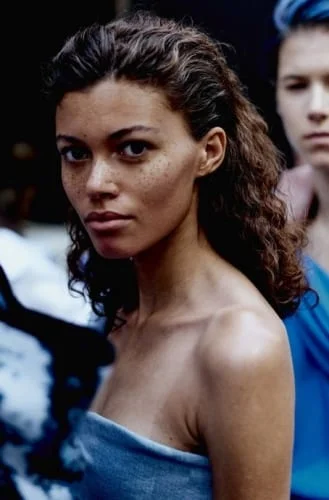 Elegant slicked back Thanksgiving hairstyle for natural curly hair with volume