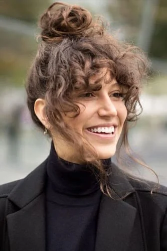Elegant messy updo Thanksgiving hairstyle for medium length hair with face-framing pieces