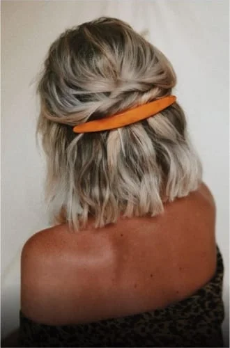 Thanksgiving hairstyle with decorative barrettes - trending hair accessories for holiday looks