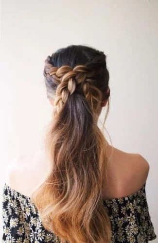 Romantic wedding ponytail with braided detail - boho-inspired bridal hairstyle