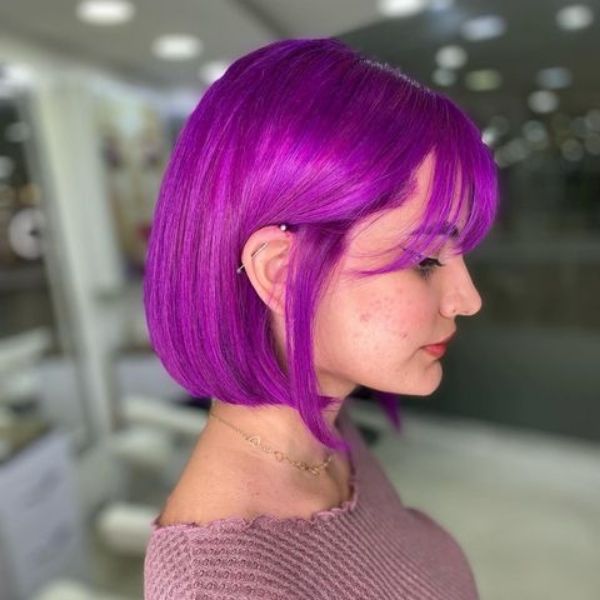 Bob Wolf Cut Hair - A woman wearing a purple top