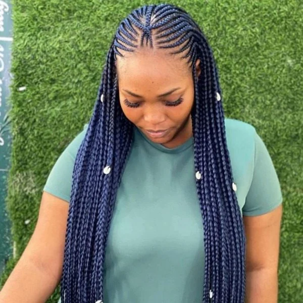 Center Part Lemonade Braids Hair - A woman wearing a mint green top