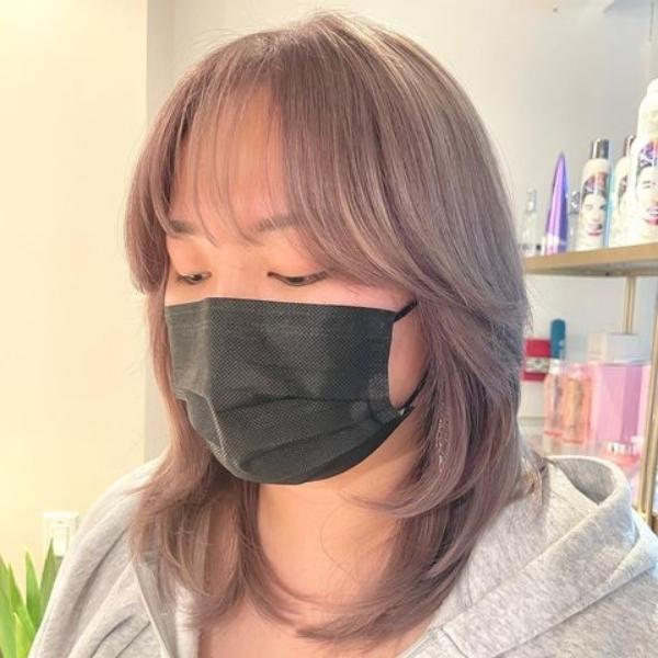 Clean for Asian Women - A woman wearing a black mask