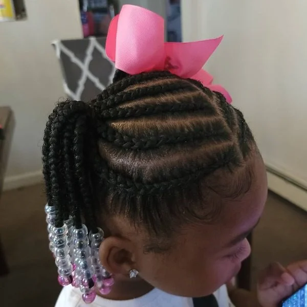 Cute Weave Braids with beads and ribbon - a woman wearing white shirt.