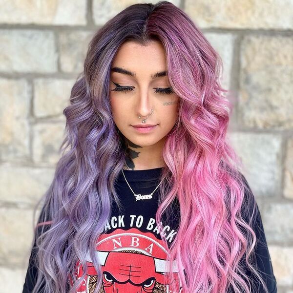 Dichromatic Pink and Purple on Long Wavy Hair - a woman wearing printed black shirt.