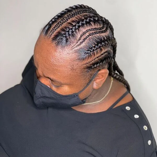 Feed in Braids for Black Women - a woman wearing black blouse.