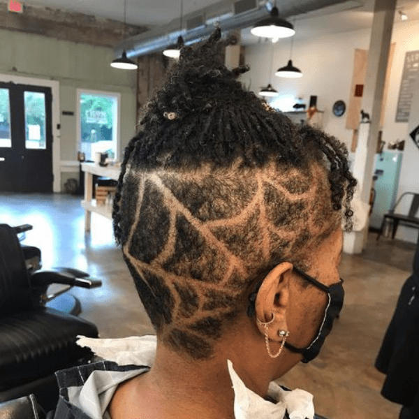 Flower Spider Web Undercut Hair - A woman inside a salon