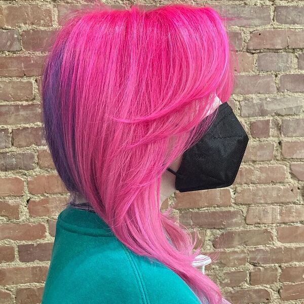 Glossy Pink with Purple Streaks in Mohawk - a woman wearing sage green shirt with mask.