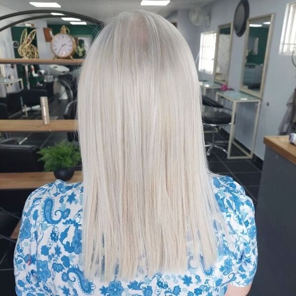 Healthy Platinum Blonde Straight Hair - A woman wearing a shirt
